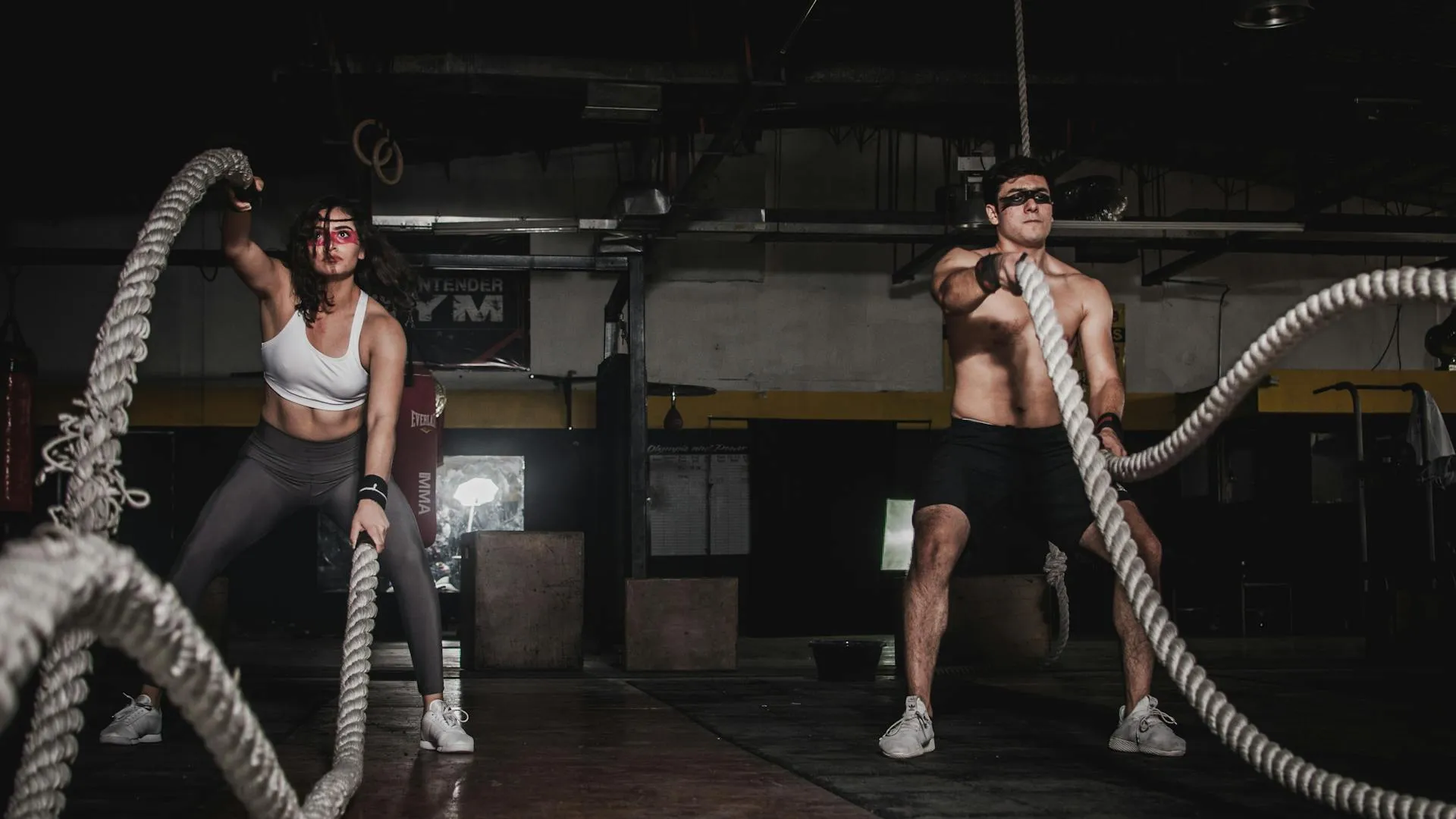 Athlete training in a dark gym environment